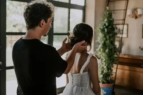 Hairstylist styling a client's hair