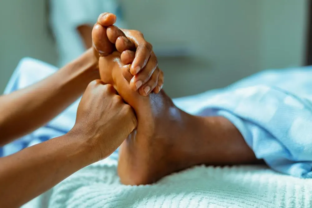 Therapist giving a foot massage