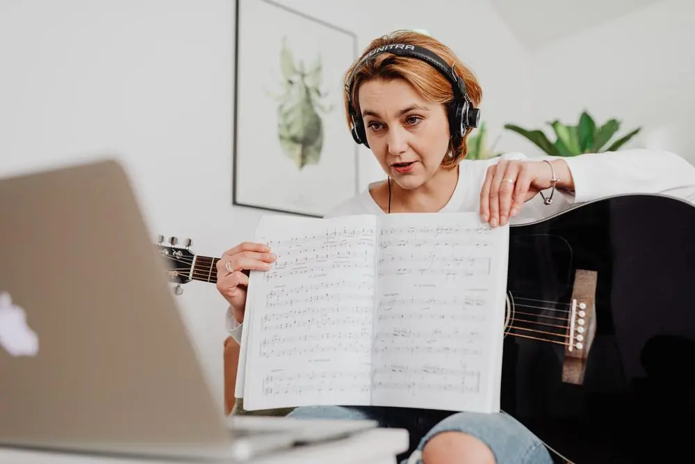 Teacher showing sheet music during an online lesson
